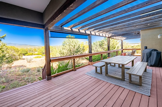 wooden terrace featuring a mountain view, a grill, and a pergola