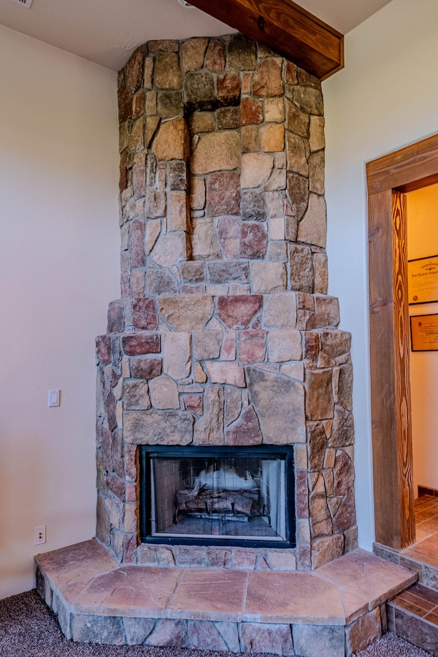 details with a stone fireplace