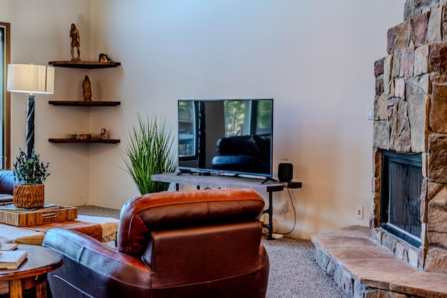 carpeted living room featuring a fireplace