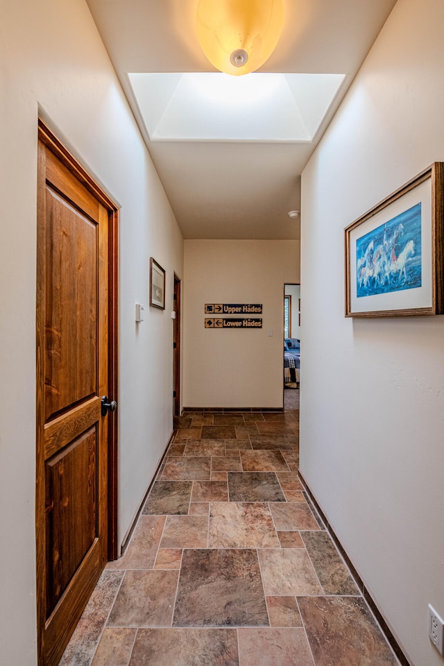 hall featuring a skylight