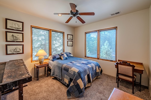 carpeted bedroom with ceiling fan