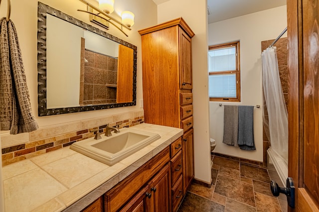 full bathroom featuring backsplash, vanity, shower / tub combo, and toilet