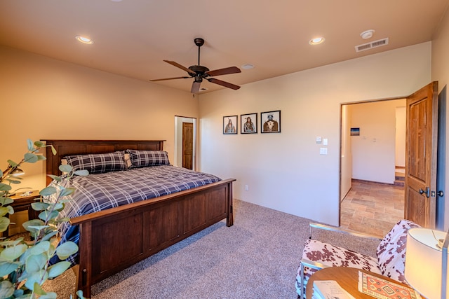 carpeted bedroom with ceiling fan