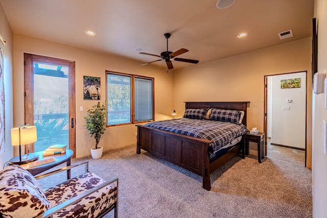 bedroom with ceiling fan and light carpet