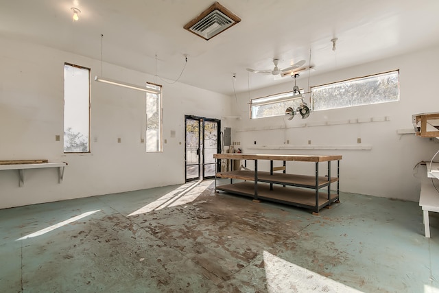 garage featuring electric panel and ceiling fan