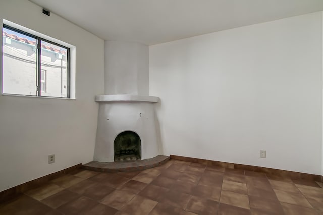 unfurnished living room with a large fireplace