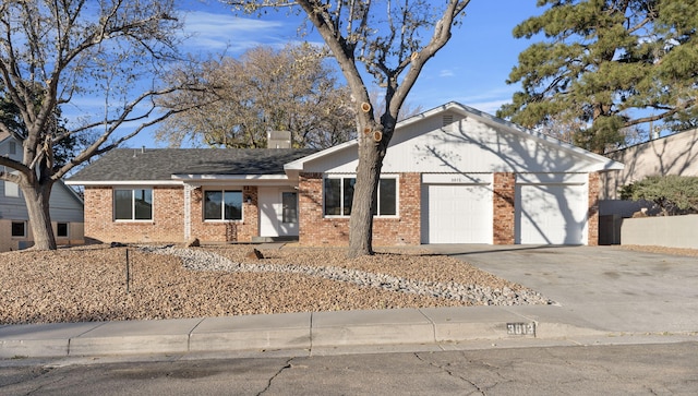 single story home featuring a garage