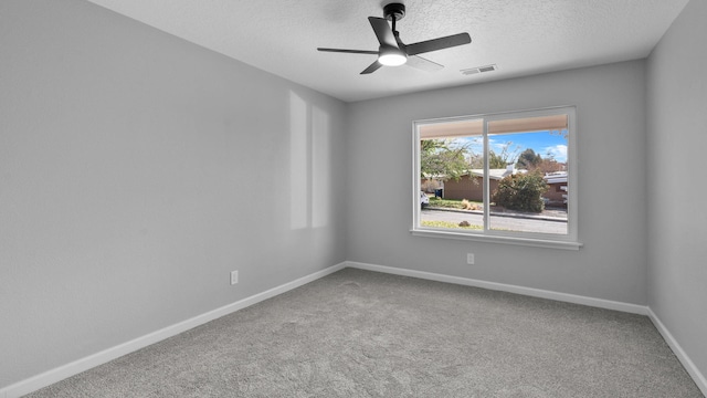 empty room with ceiling fan and carpet floors