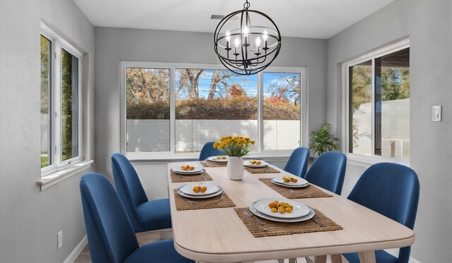 dining area featuring a chandelier