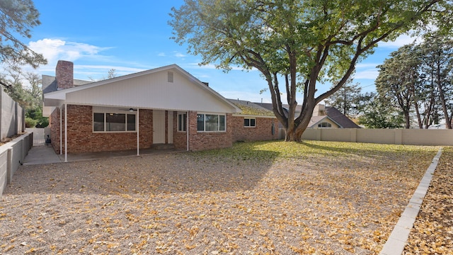 back of house featuring ceiling fan