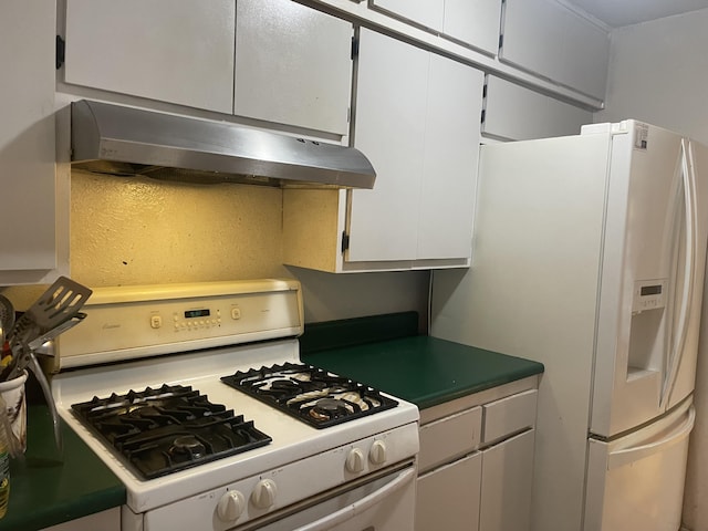 kitchen with white cabinetry and white appliances