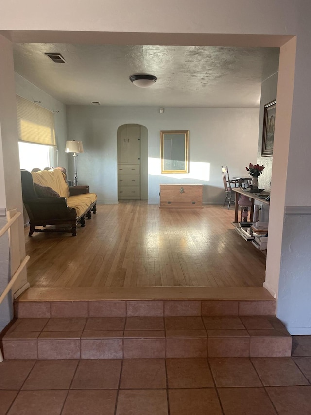 hall with wood-type flooring