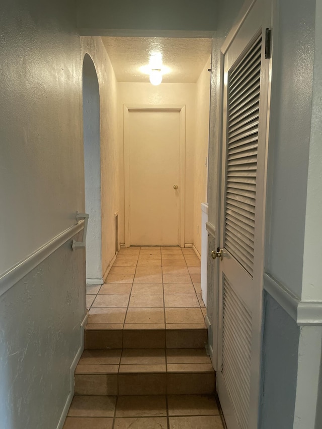 hall with light tile patterned flooring