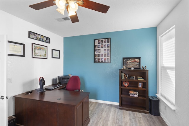 office with ceiling fan and light wood-type flooring