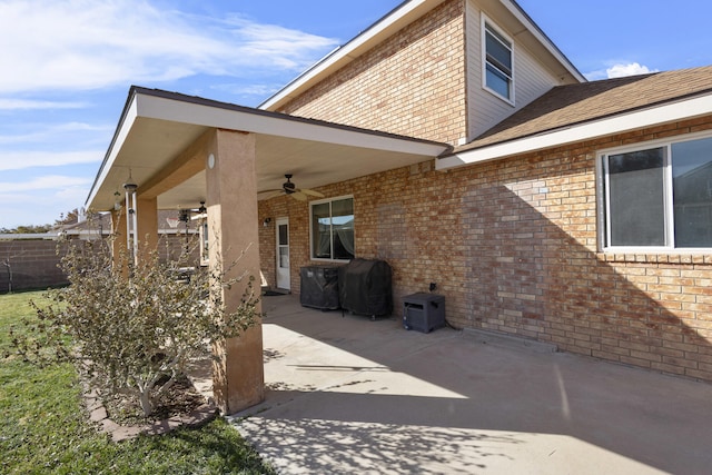 back of property with a patio and ceiling fan