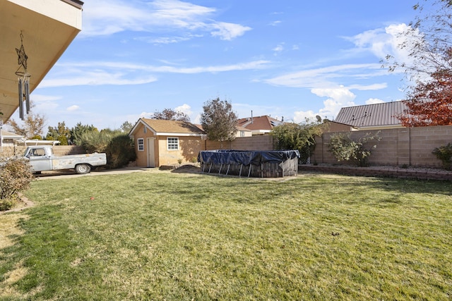 view of yard with an outdoor structure and a covered pool