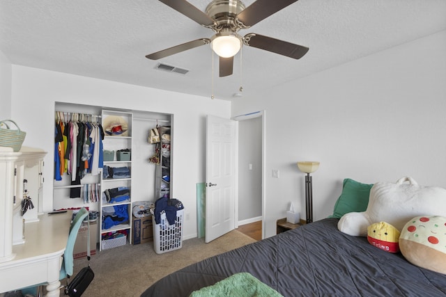 bedroom featuring ceiling fan, carpet flooring, and a closet