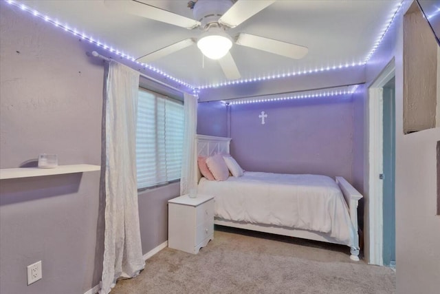 bedroom featuring ceiling fan and light colored carpet