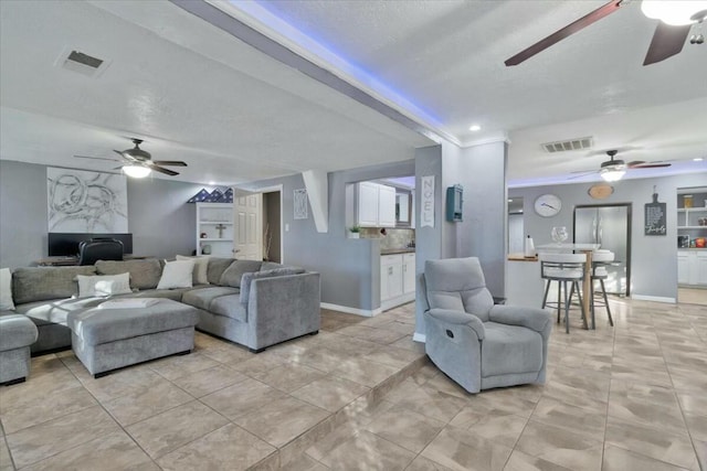 121 Hosher Ave SE, Albuquerque, NM 87102 - living room featuring a ceiling fan and light tile patterned floors
