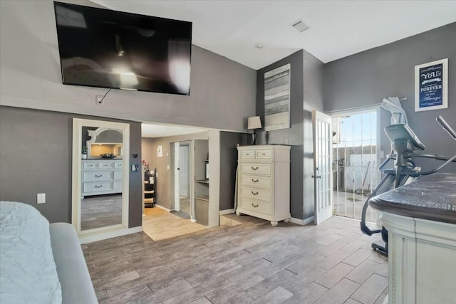 121 Hosher Ave SE, Albuquerque, NM 87102 - bedroom featuring wood finished floors and a high ceiling