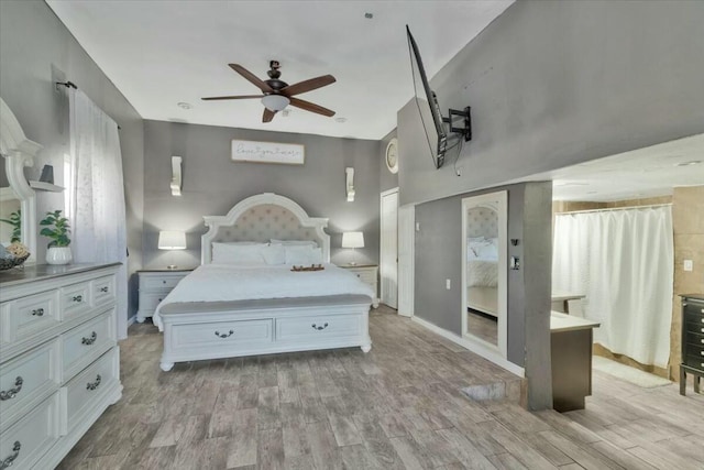 bedroom featuring ceiling fan and light hardwood / wood-style floors