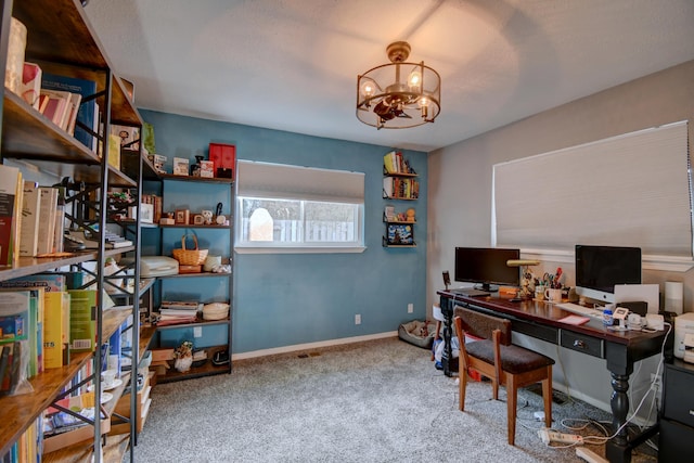 office area with a notable chandelier, carpet flooring, and baseboards