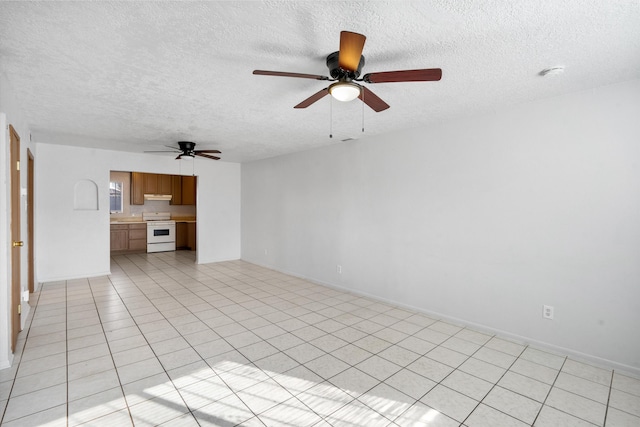 unfurnished living room with ceiling fan, light tile patterned floors, and a textured ceiling