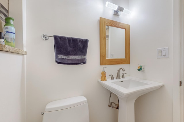 bathroom with toilet and sink