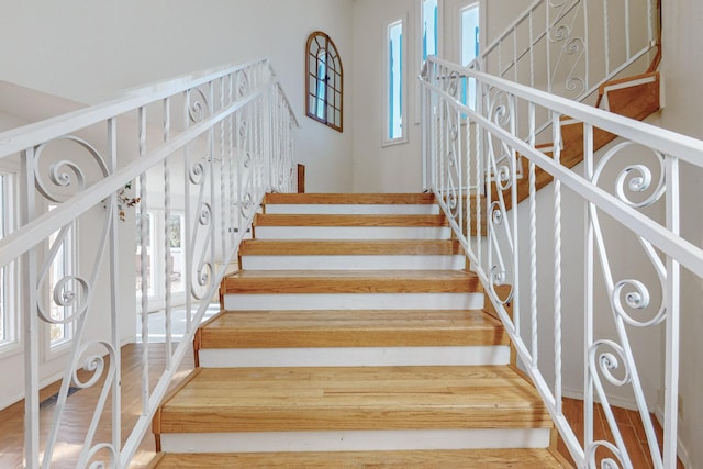 stairs with wood-type flooring