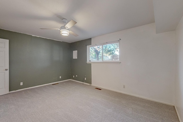 carpeted empty room featuring ceiling fan