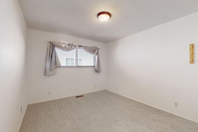 unfurnished room with carpet flooring