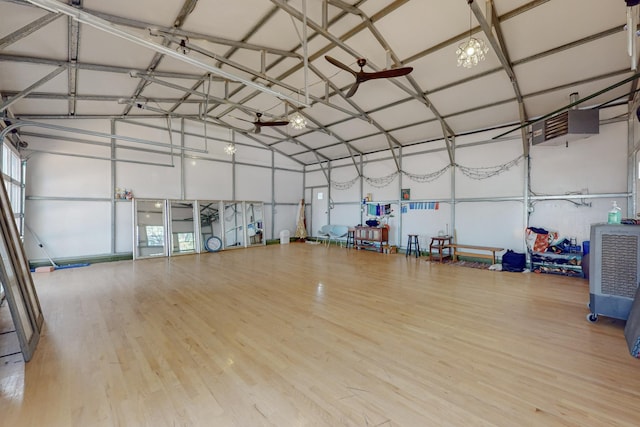 garage featuring ceiling fan and a garage door opener