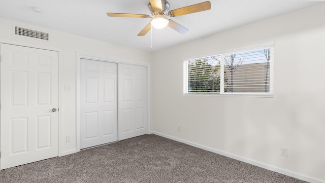 unfurnished bedroom with carpet flooring and ceiling fan