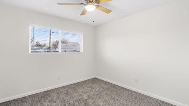 empty room with ceiling fan and carpet floors