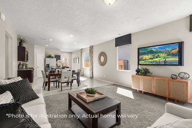 carpeted living room with a textured ceiling