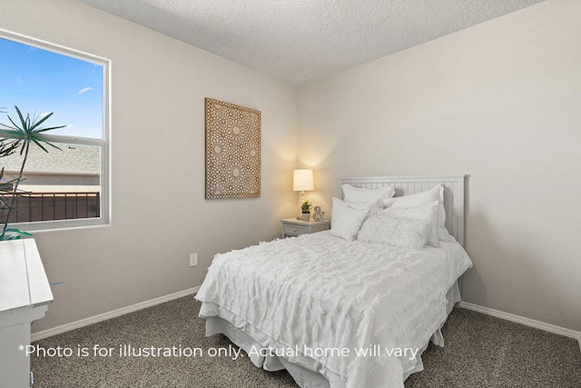 bedroom with a textured ceiling and dark carpet