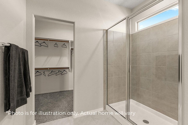 bathroom featuring a shower with shower door