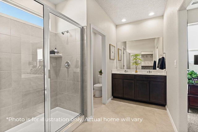 bathroom featuring tile patterned flooring, toilet, a shower with door, and a textured ceiling