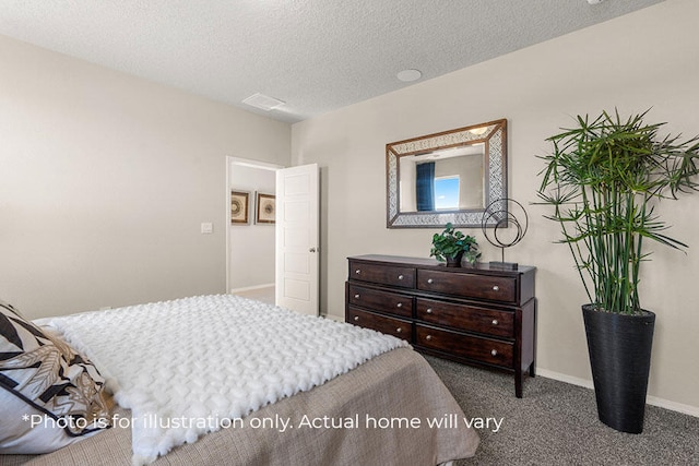 bedroom with carpet flooring and a textured ceiling