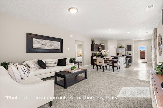 carpeted living room with a textured ceiling