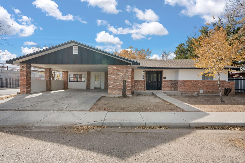 ranch-style home with a carport