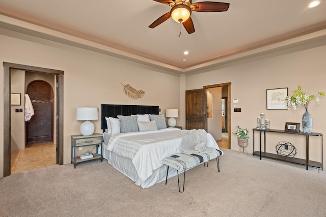 carpeted bedroom with ceiling fan