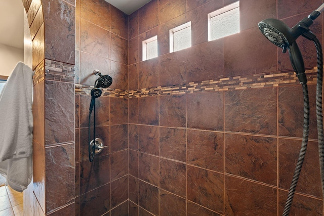 bathroom with tiled shower