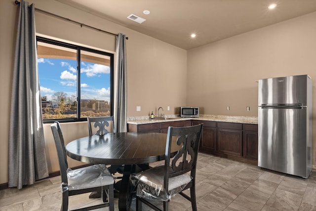 dining room featuring sink