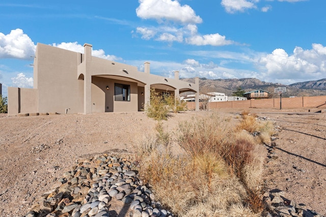 rear view of property with a mountain view