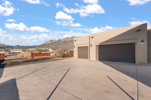 exterior space featuring a mountain view and a garage