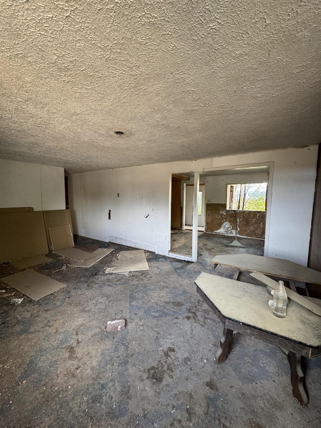 interior space featuring a textured ceiling