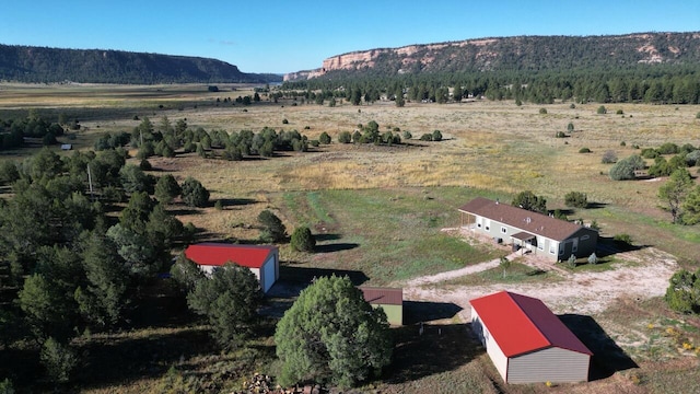 drone / aerial view with a mountain view and a rural view