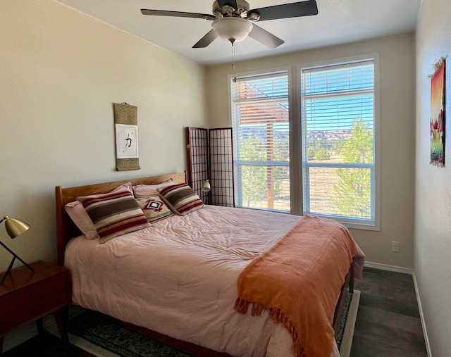 bedroom featuring ceiling fan and dark hardwood / wood-style floors