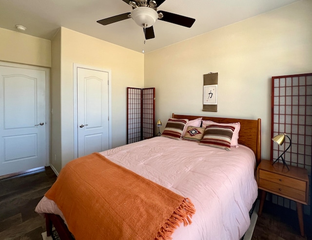 bedroom featuring a closet, ceiling fan, and dark wood-type flooring